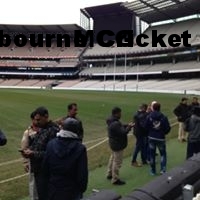 a group of people standing in the grass