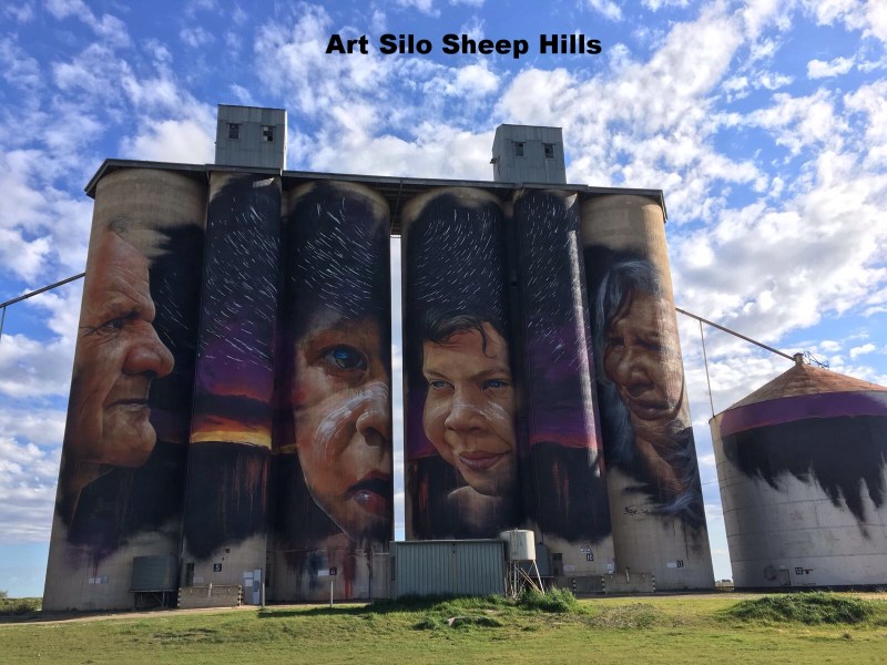 a man standing in front of a building