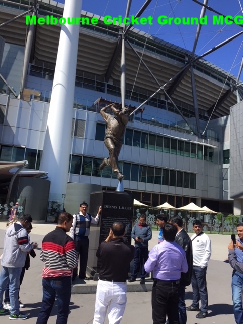 a group of people standing in front of a building