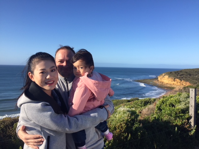 a person standing in front of a body of water