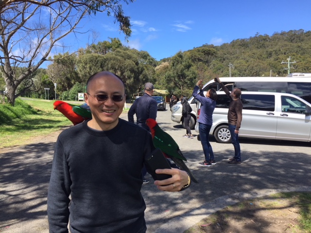 a group of people standing in a parking lot