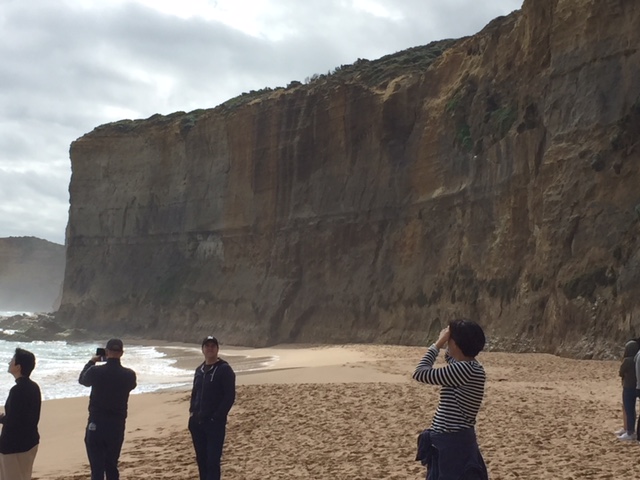 a group of people standing on top of a mountain