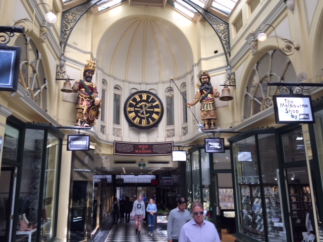 a group of people walking in front of a store
