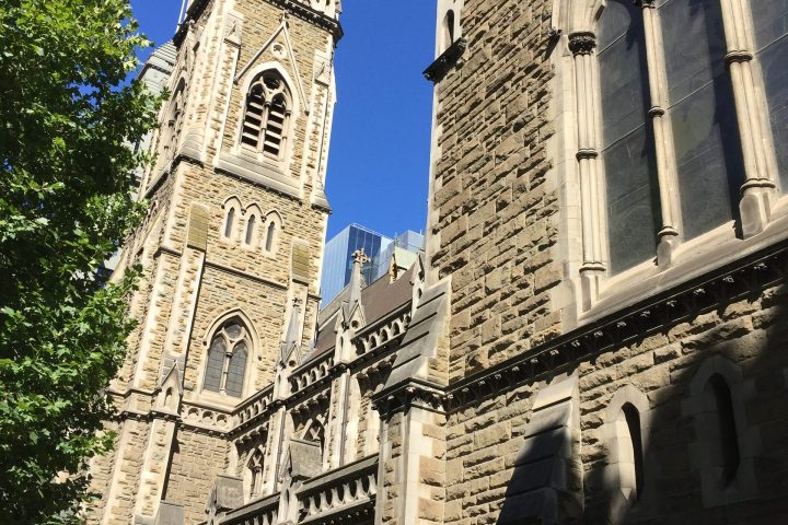 a large stone building with a clock